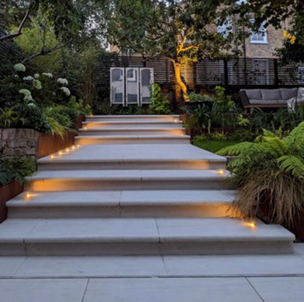 Step lights set into stone garden steps
