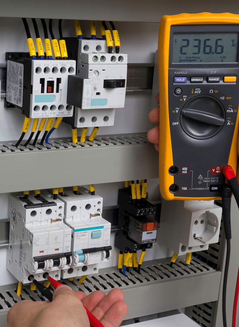 Live testing during an inspection — readings taken circuit by circuit and written into the report rather than remembered.